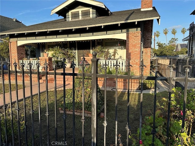 view of gate with fence