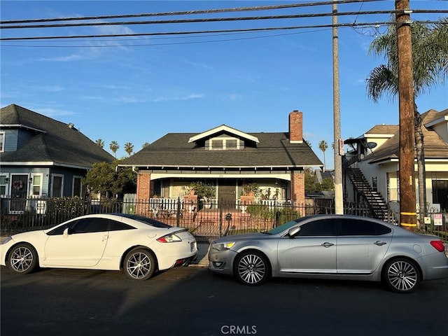 521 S Chicago St, Los Angeles, CA 90033 - view of front of property with brick siding and a fenced front yard