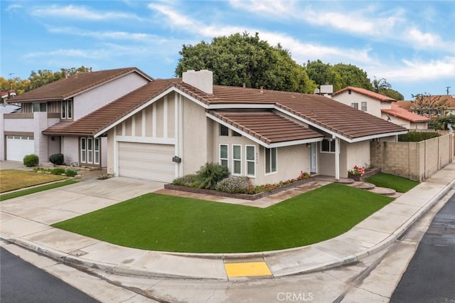 view of front of house with a garage and a front yard