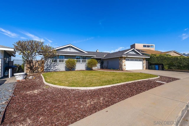 view of front of house with a garage and a front lawn