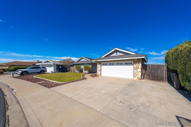 ranch-style home featuring a garage and a front lawn