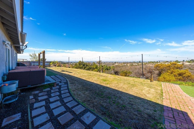 view of yard with an outdoor hangout area and a patio