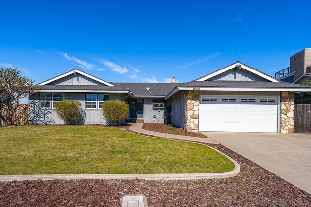 ranch-style home with a garage and a front yard