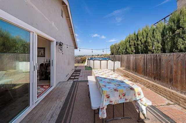 deck with a covered pool