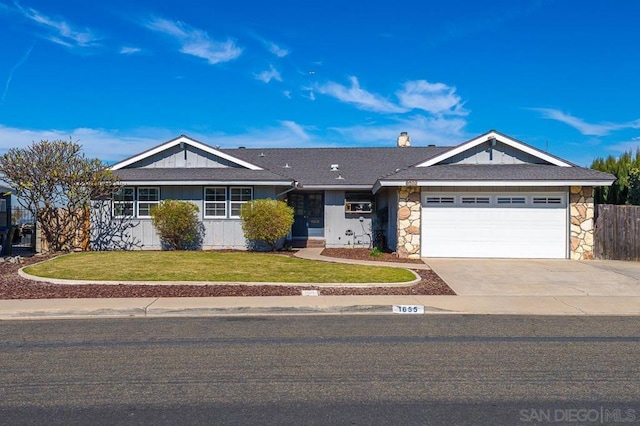 single story home featuring a garage and a front lawn