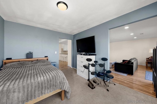 bedroom featuring light colored carpet