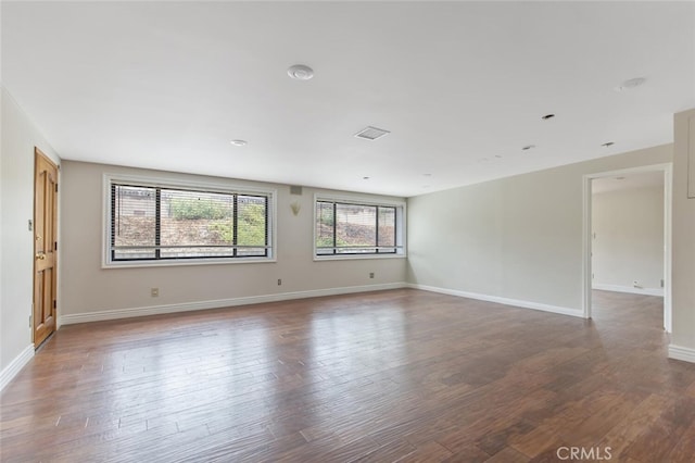 spare room with hardwood / wood-style flooring