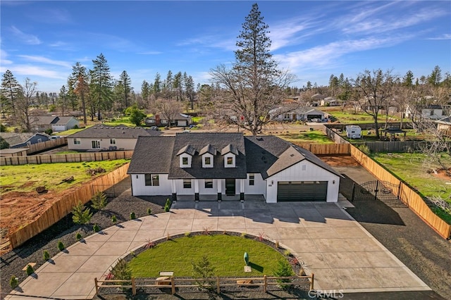 view of front of property featuring a garage and a front yard