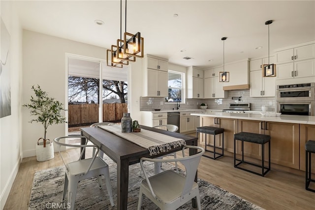 dining room featuring light hardwood / wood-style floors