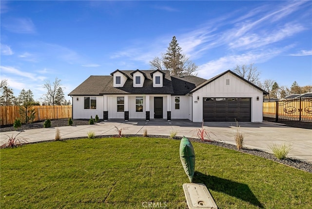 modern farmhouse style home with a garage and a front lawn