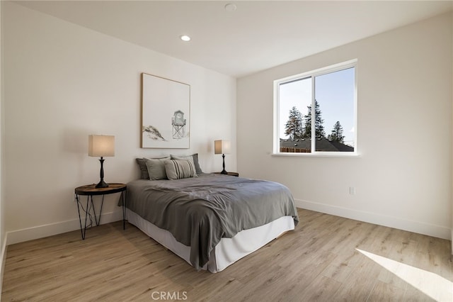 bedroom with light hardwood / wood-style floors