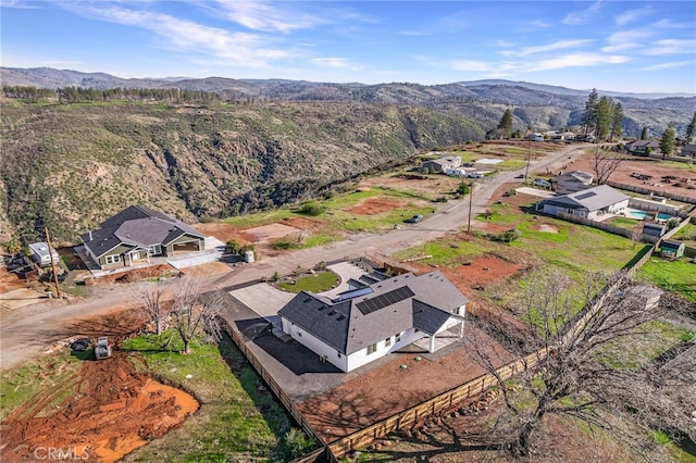 drone / aerial view featuring a mountain view