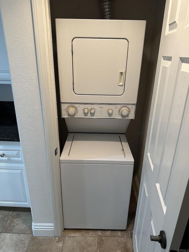 washroom with stacked washer and clothes dryer