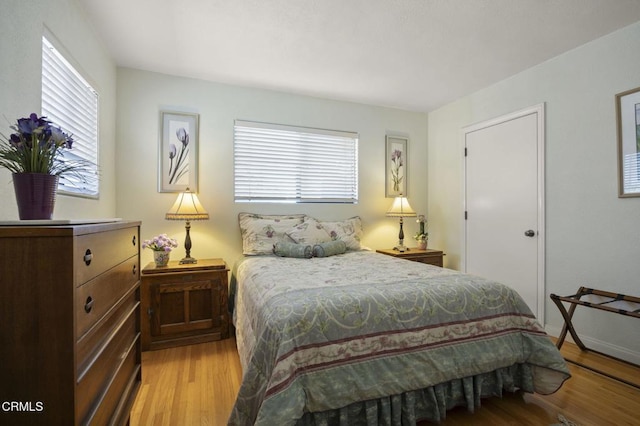 bedroom with light hardwood / wood-style flooring