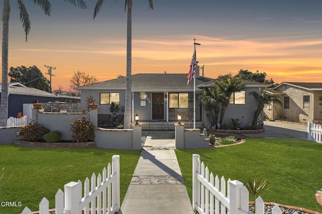 view of front of property with a yard