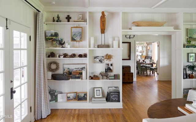 room details with hardwood / wood-style floors and built in shelves