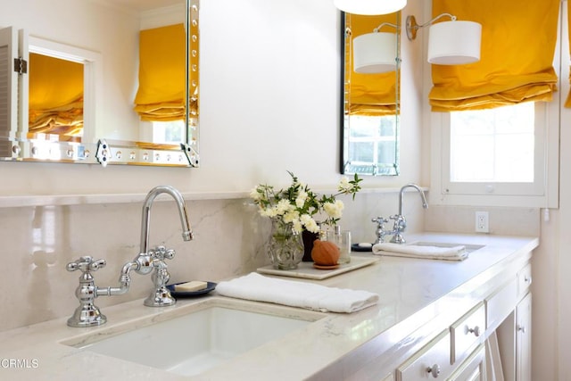 kitchen with white cabinetry and sink