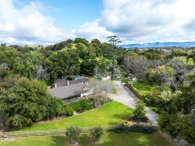 drone / aerial view with a mountain view and a rural view