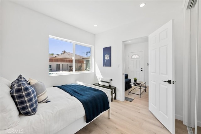 bedroom with light hardwood / wood-style floors