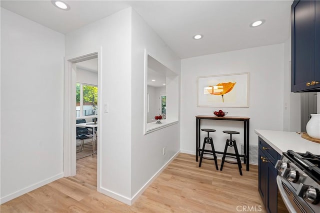 hall with light hardwood / wood-style flooring