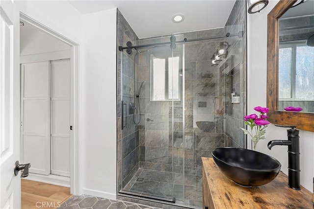 bathroom with sink and an enclosed shower