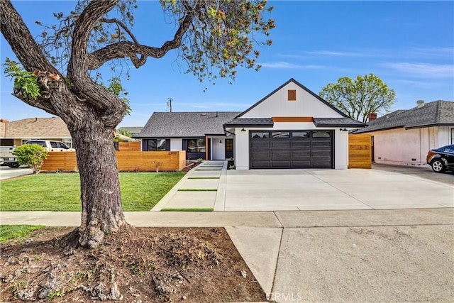 view of front facade with a garage and a front lawn