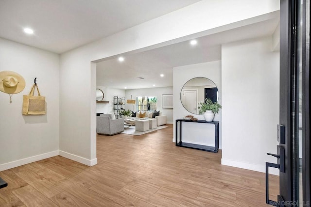 foyer entrance with light wood-type flooring