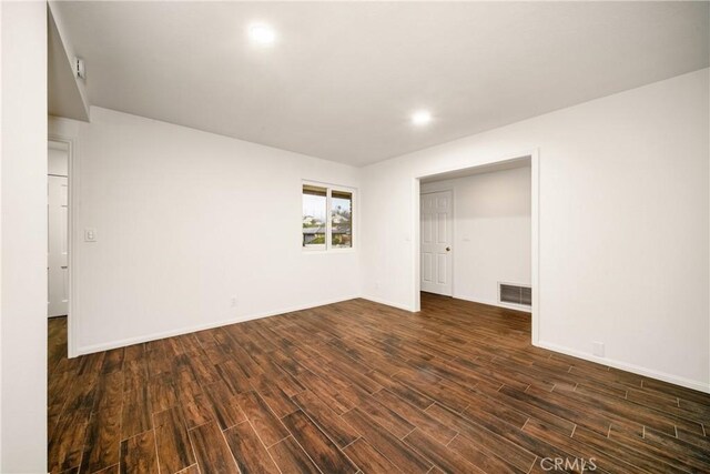 unfurnished bedroom featuring dark hardwood / wood-style floors