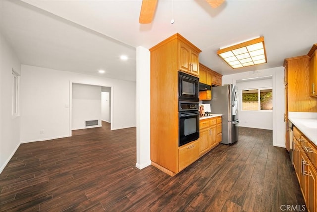 kitchen with range hood, dark wood-type flooring, ceiling fan, and black appliances