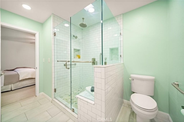 bathroom with toilet and walk in shower