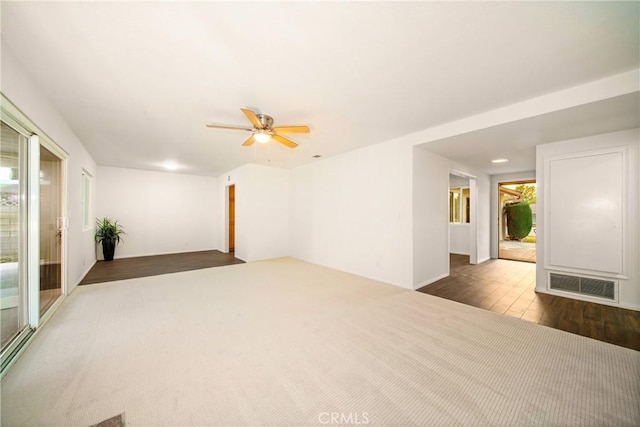 unfurnished room featuring dark hardwood / wood-style flooring and ceiling fan