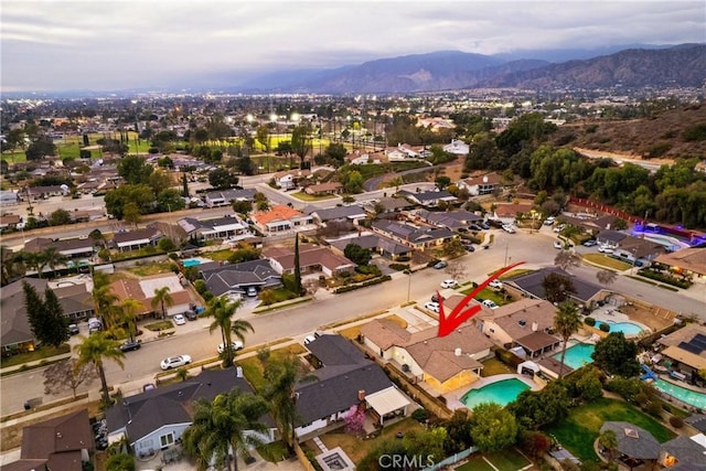 drone / aerial view featuring a mountain view