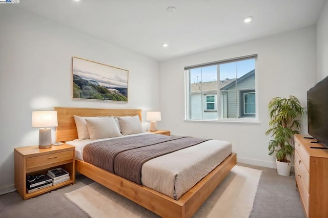 bedroom featuring light carpet