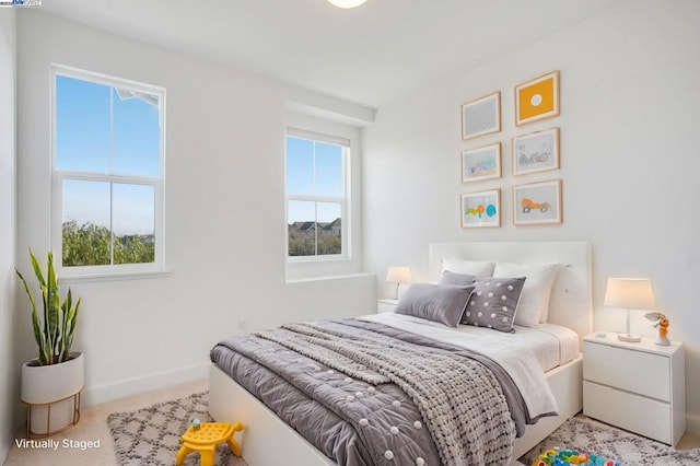 bedroom with light colored carpet