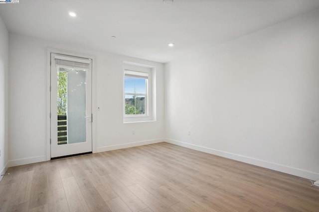 spare room with light wood-type flooring