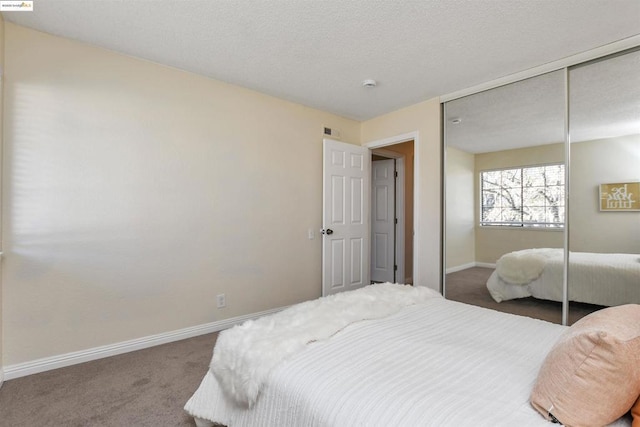 carpeted bedroom featuring a closet