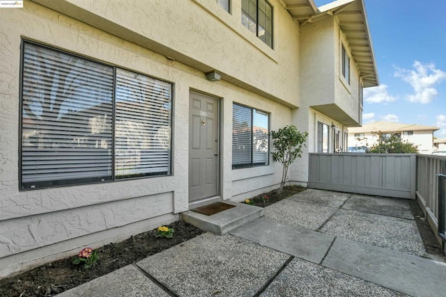 entrance to property featuring a patio