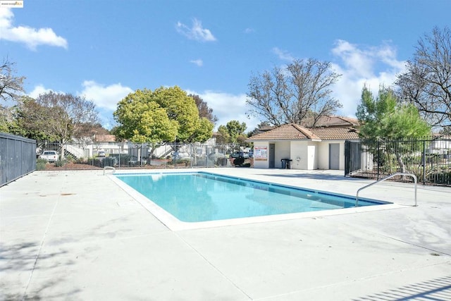 view of swimming pool with a patio area