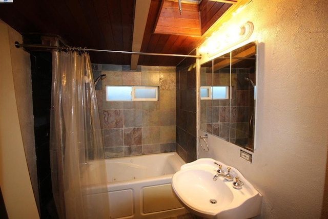 bathroom with beamed ceiling, sink, shower / bath combo with shower curtain, and wooden ceiling