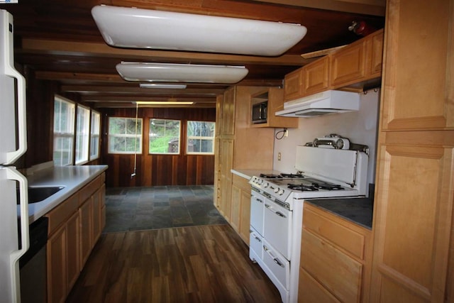 kitchen featuring dark hardwood / wood-style flooring and white appliances