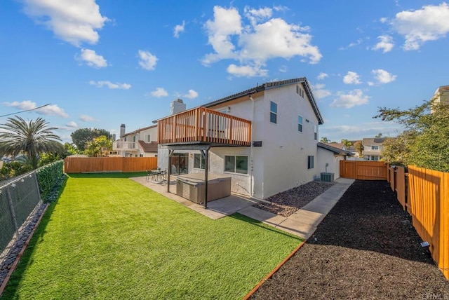 rear view of property with a balcony, a lawn, central air condition unit, and a patio area