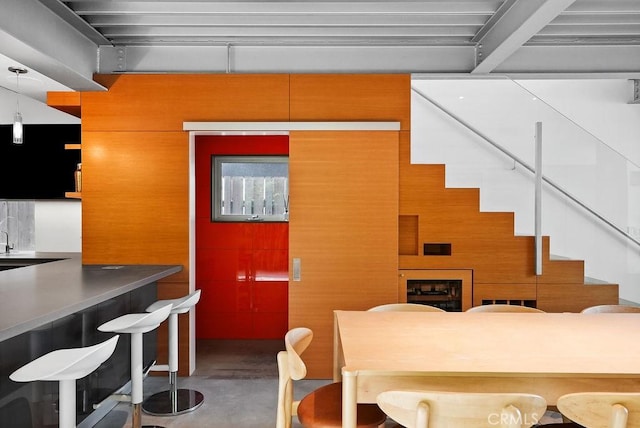 dining area with concrete flooring and sink