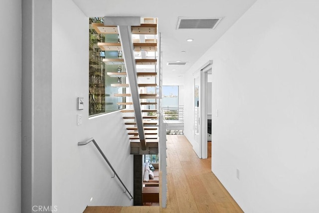 corridor featuring light hardwood / wood-style flooring