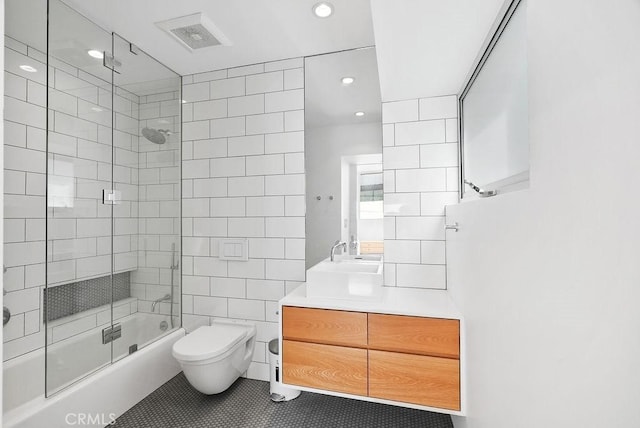 bathroom with tile patterned floors, vanity, and toilet