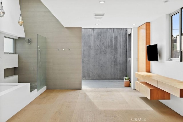 bathroom with hardwood / wood-style floors