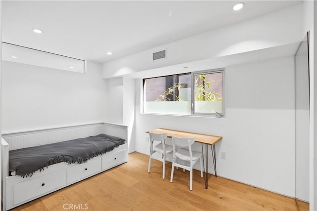 bedroom featuring hardwood / wood-style floors