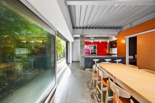 kitchen featuring appliances with stainless steel finishes and concrete floors