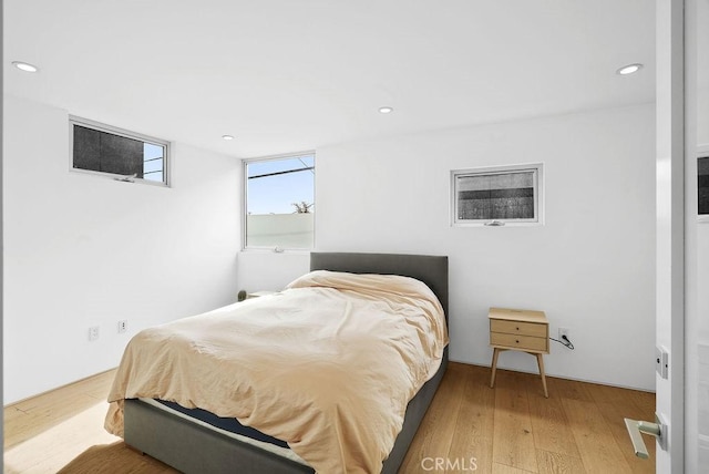 bedroom with hardwood / wood-style floors