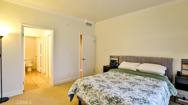 carpeted bedroom with crown molding and ensuite bathroom