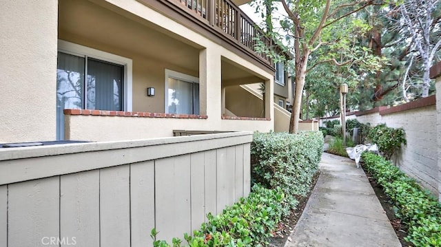 view of property exterior featuring a balcony